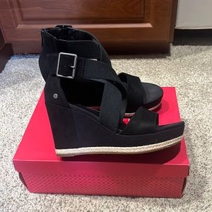 UGG black wrap wedge sandals, never worn.